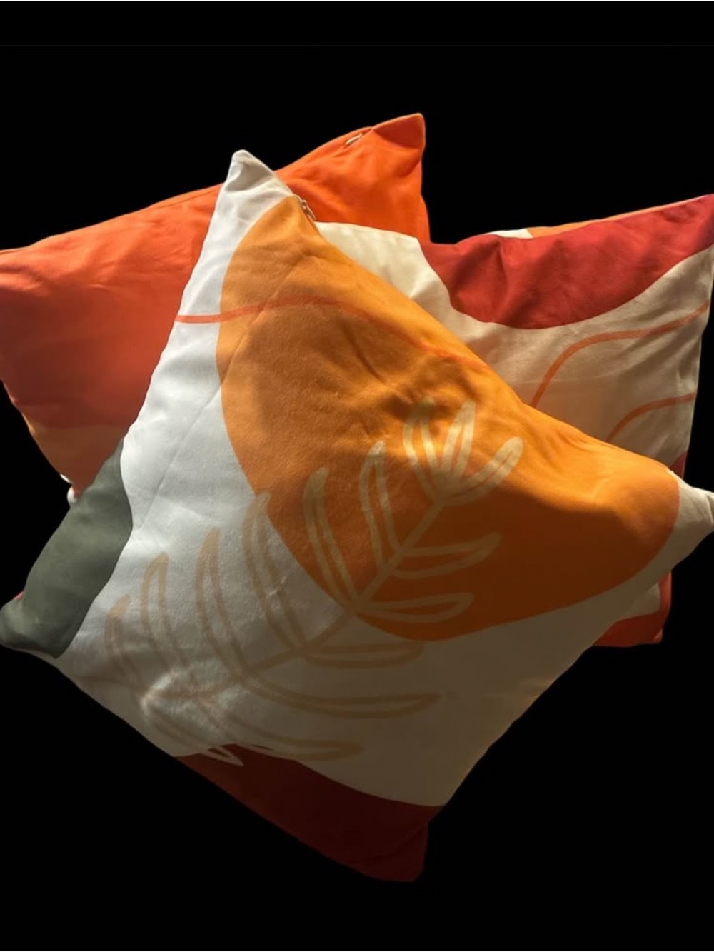 Set of Decorative Throw Pillows in Orange, Red and Cream